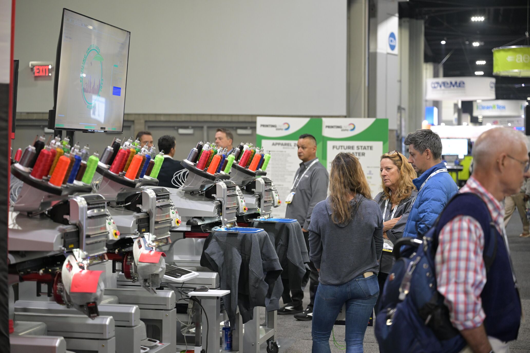 Embroidery heads loaded with neon-colored thread on display at PRINTING United Expo