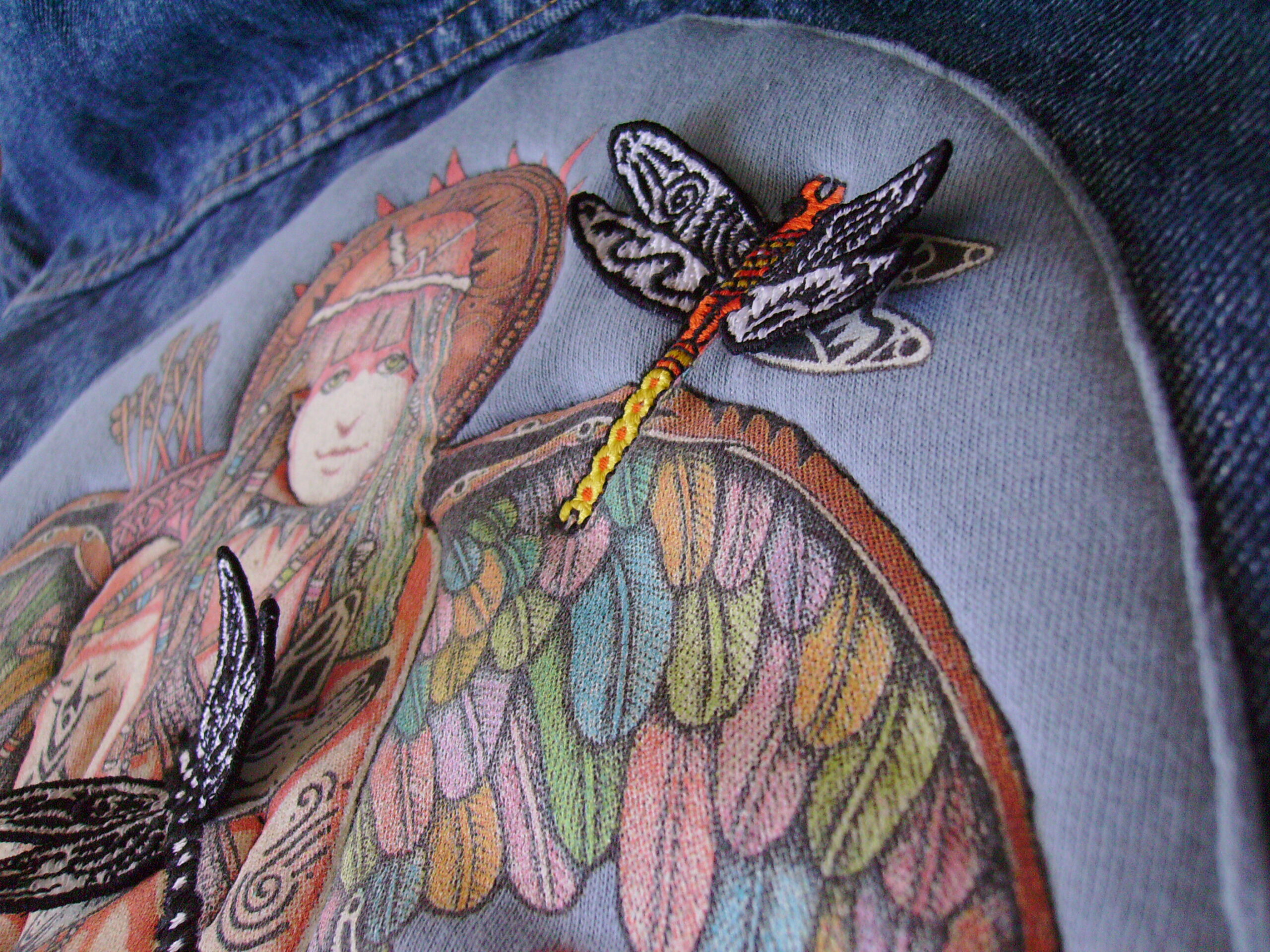 Screen printed goddess with a dragonfly embroidered on top