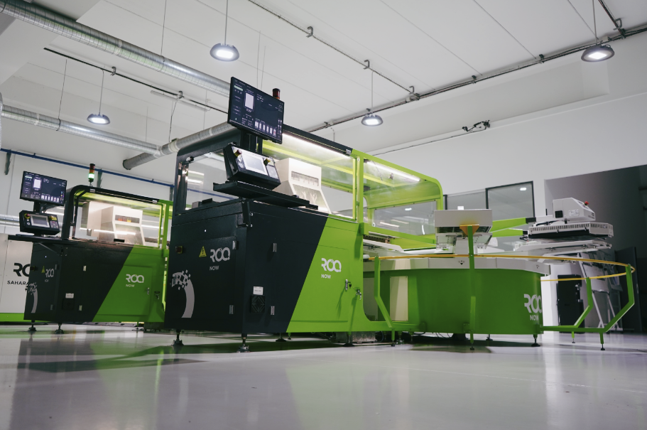 A stylized image of the ROQ NOW digital printer