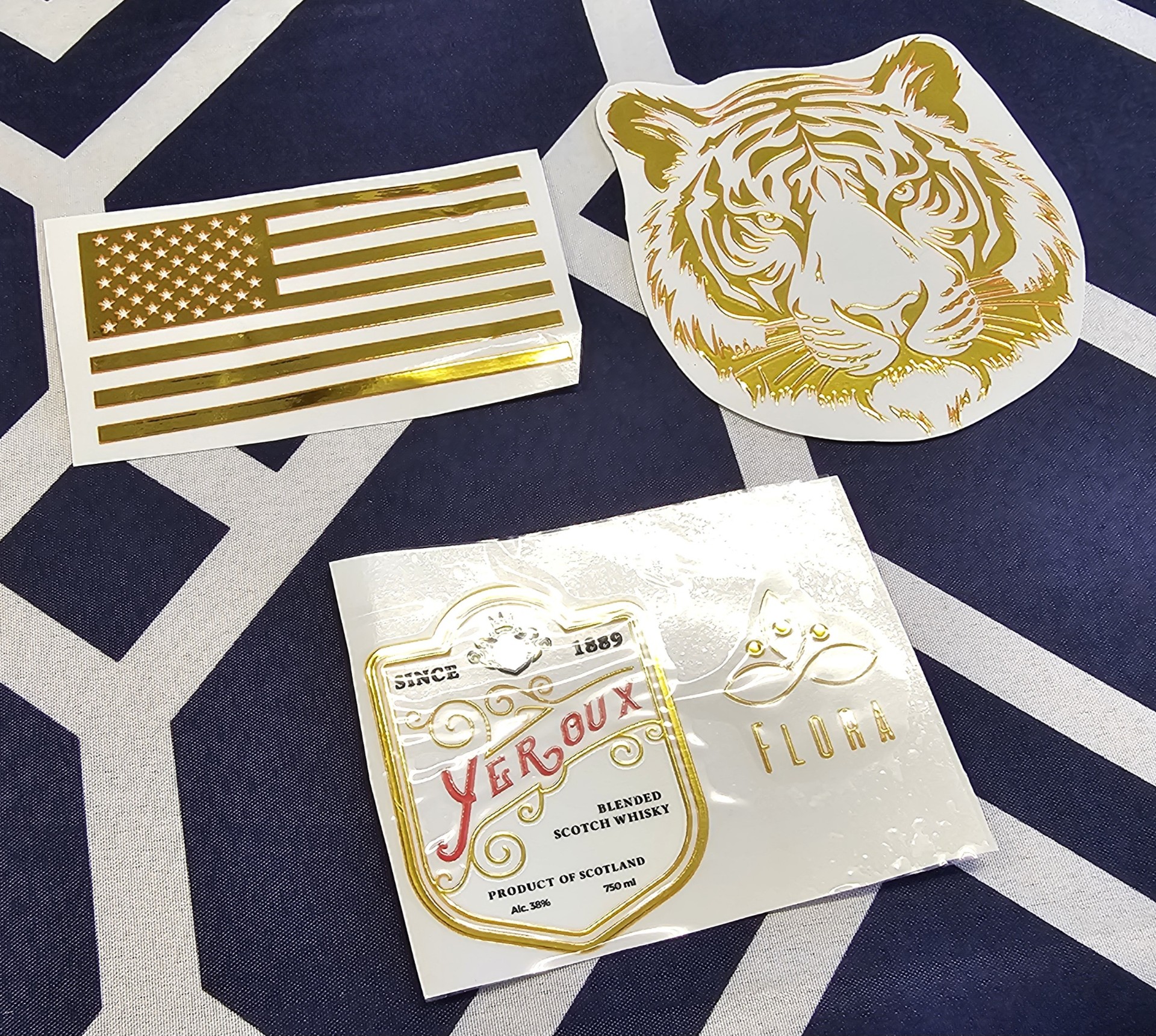 Samples of transfers printed with foil and flock using the new Titan-Jet America printers