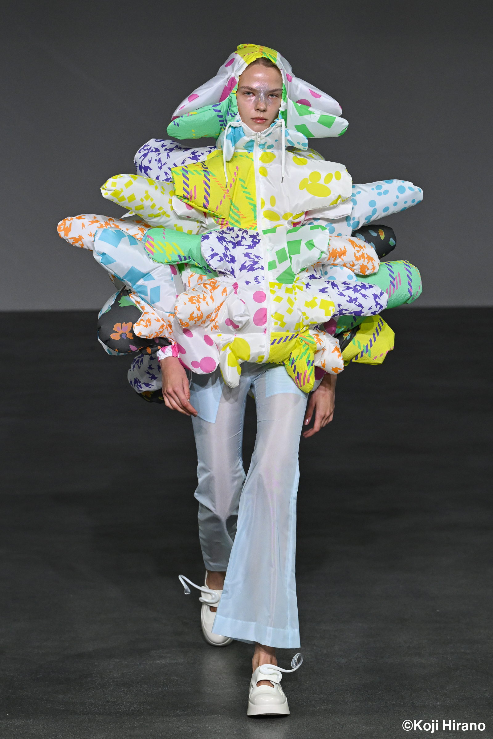 Woman wearing printed garment that looks like a cloud