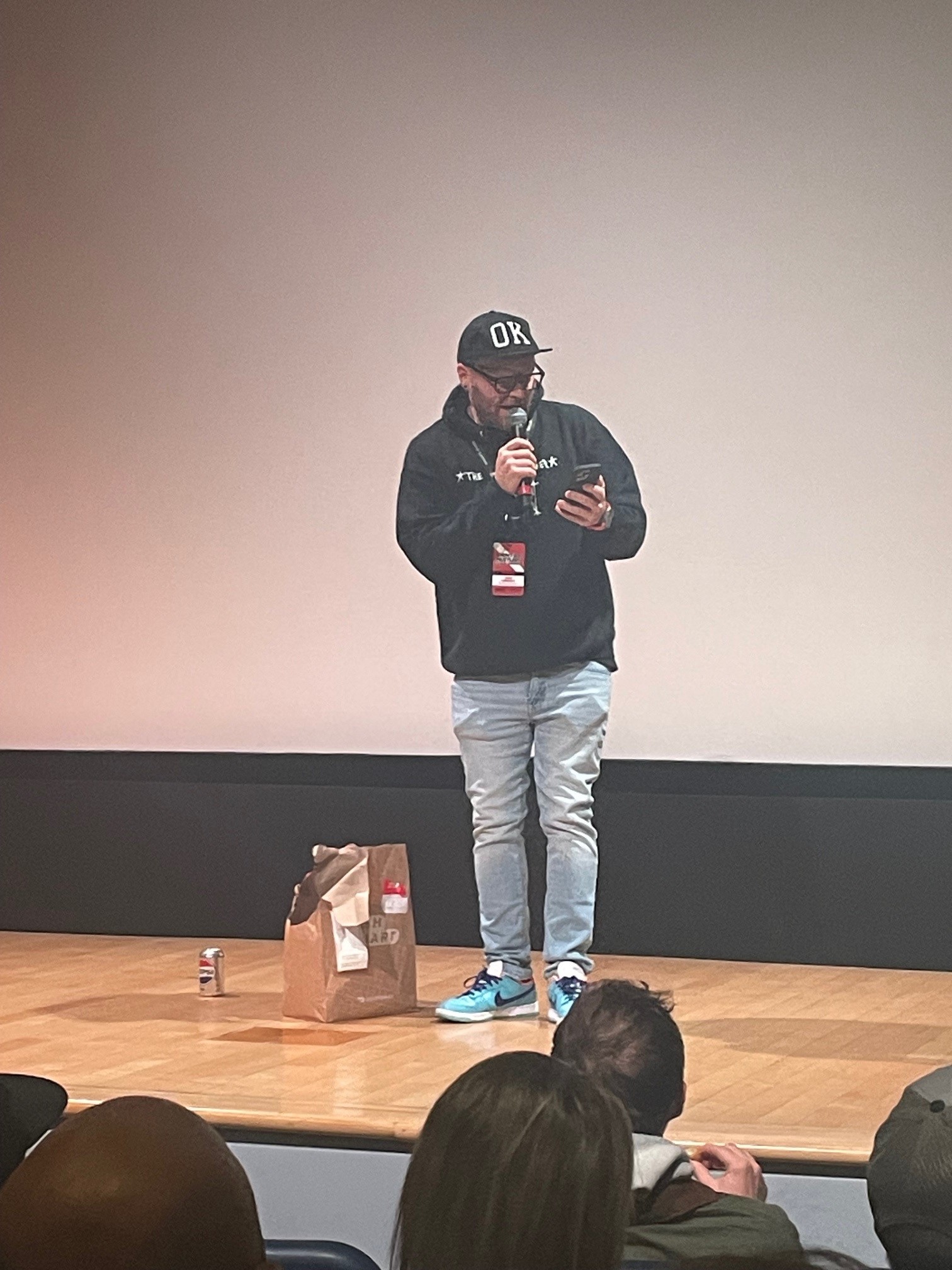 Justin Lawrence standing on stage