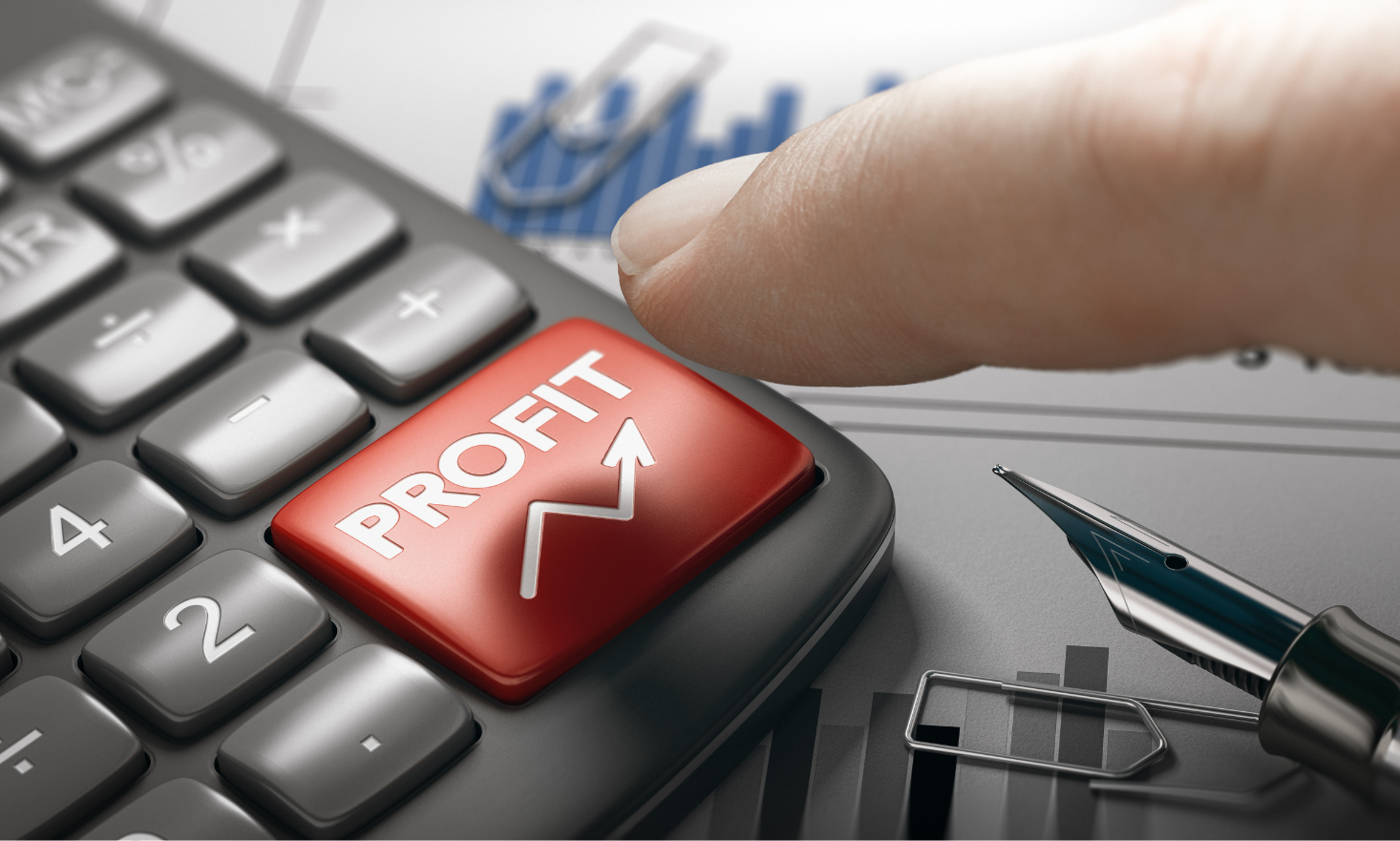 A finger clicking a red keyboard that reads "Profit"