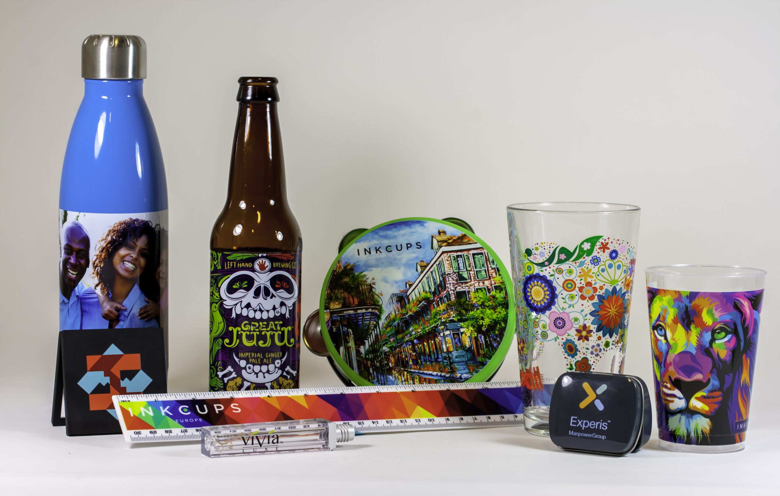 A selection of hard good demonstrating branded items such as drinkware, small signs, and pens