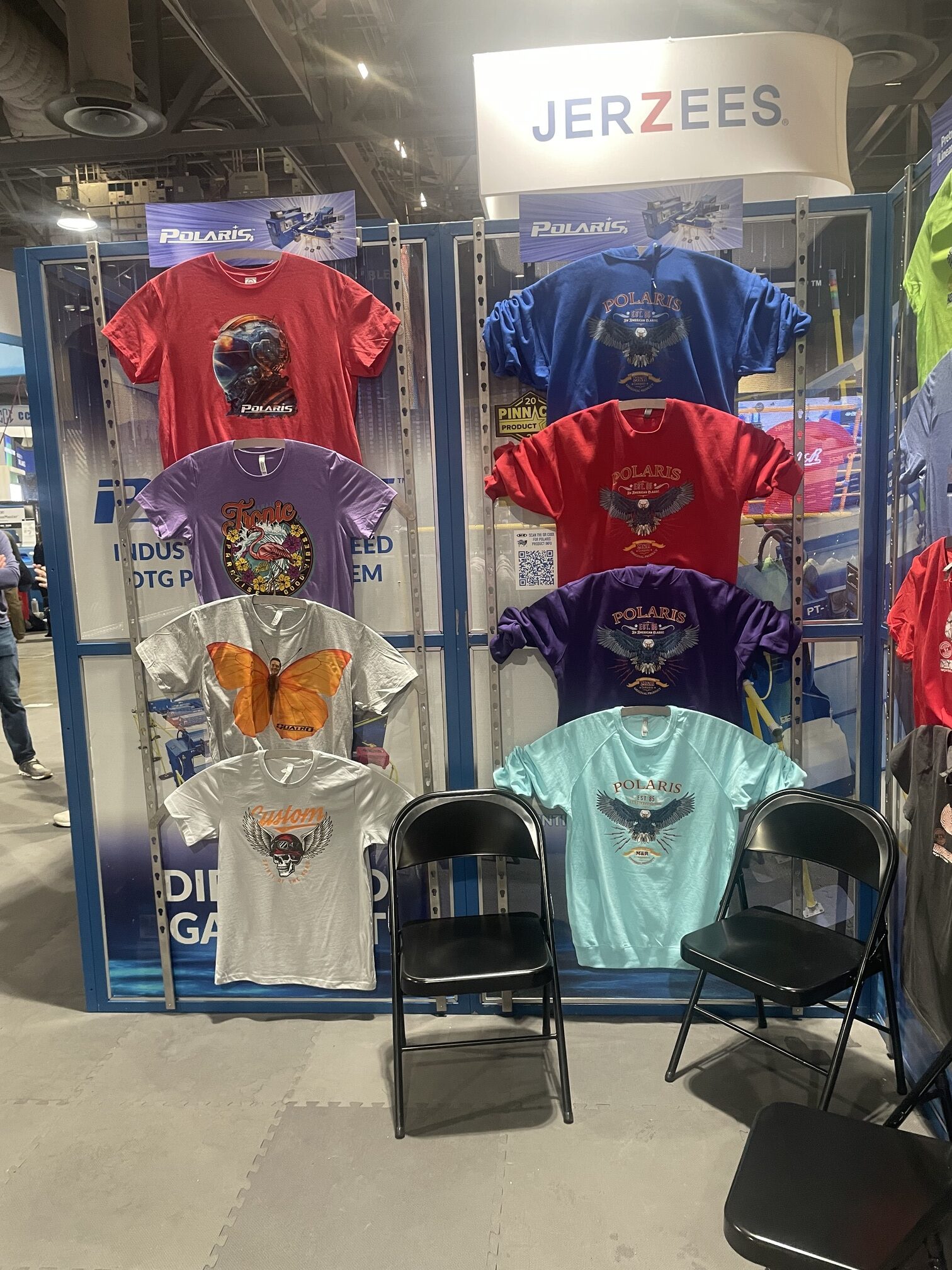 T-shirts hanging on a wall at the ISS trade show