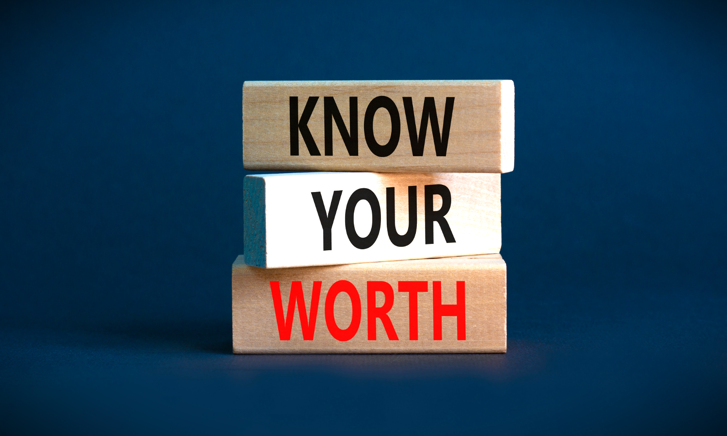 three blocks stacked that read "Know Your Worth" with dark blue background