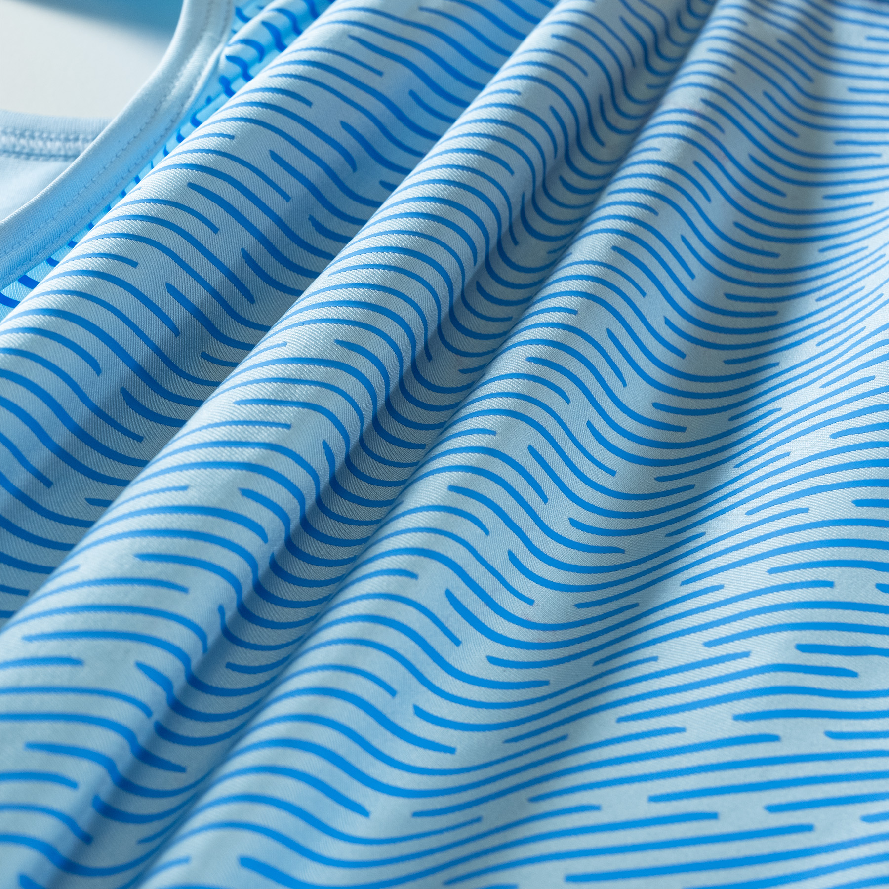 Rippling fabric printed in blue pattern