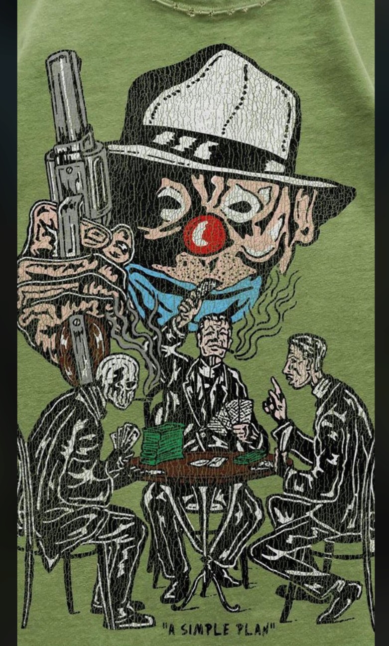 A clown print on a green T-shirt demonstrating the crackle printing process