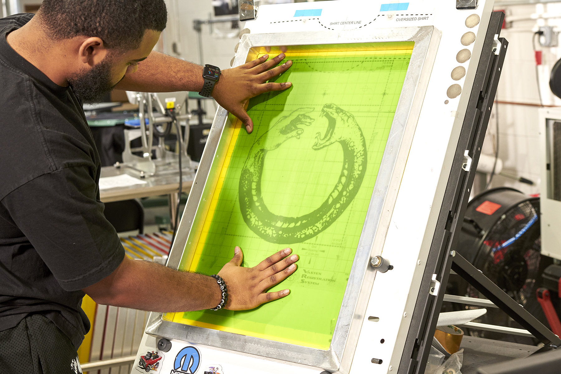 Joaquin Harrell examines a screen