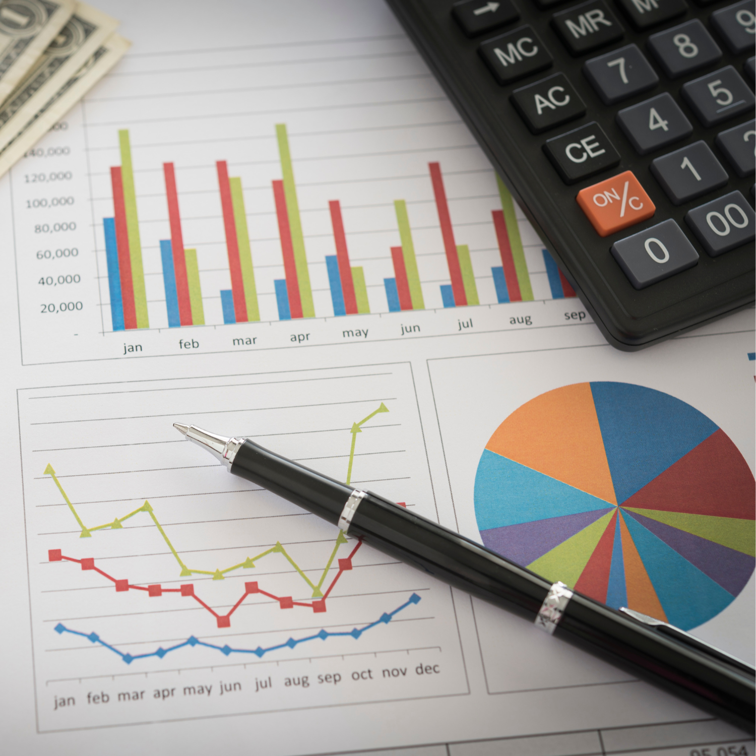 A graphic of a bar graph tracking financial planning with a pen and a corner of a keyboard in the top right corner