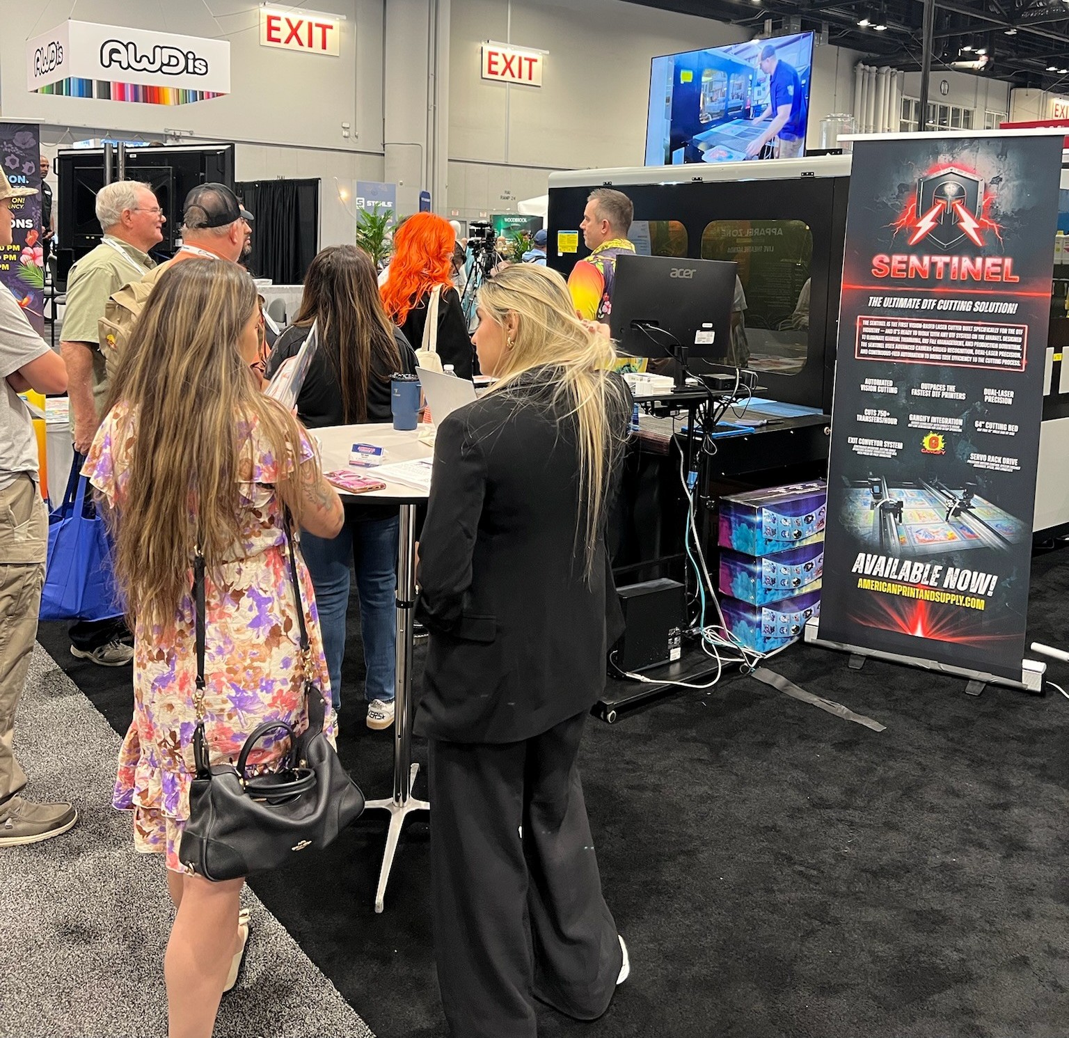 Attendees looking at the Sentinel dtf printing machine