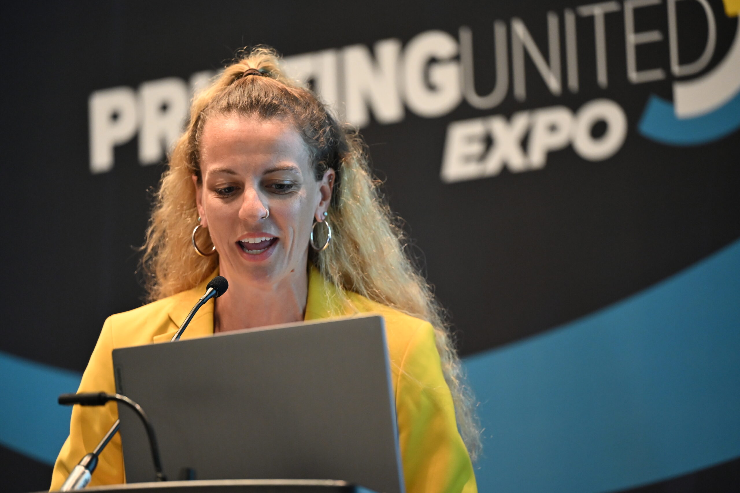 Woman presenting presentation at PRINTING United Expo