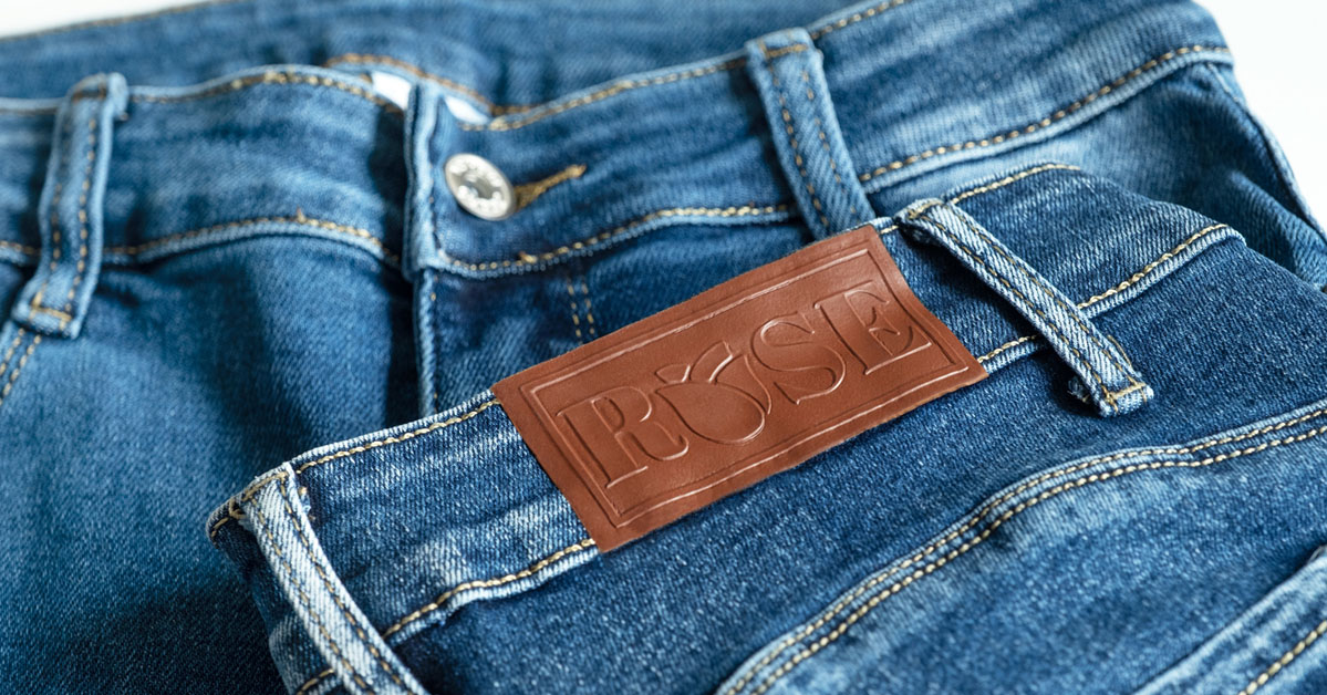 faux leather patch on denim jeans