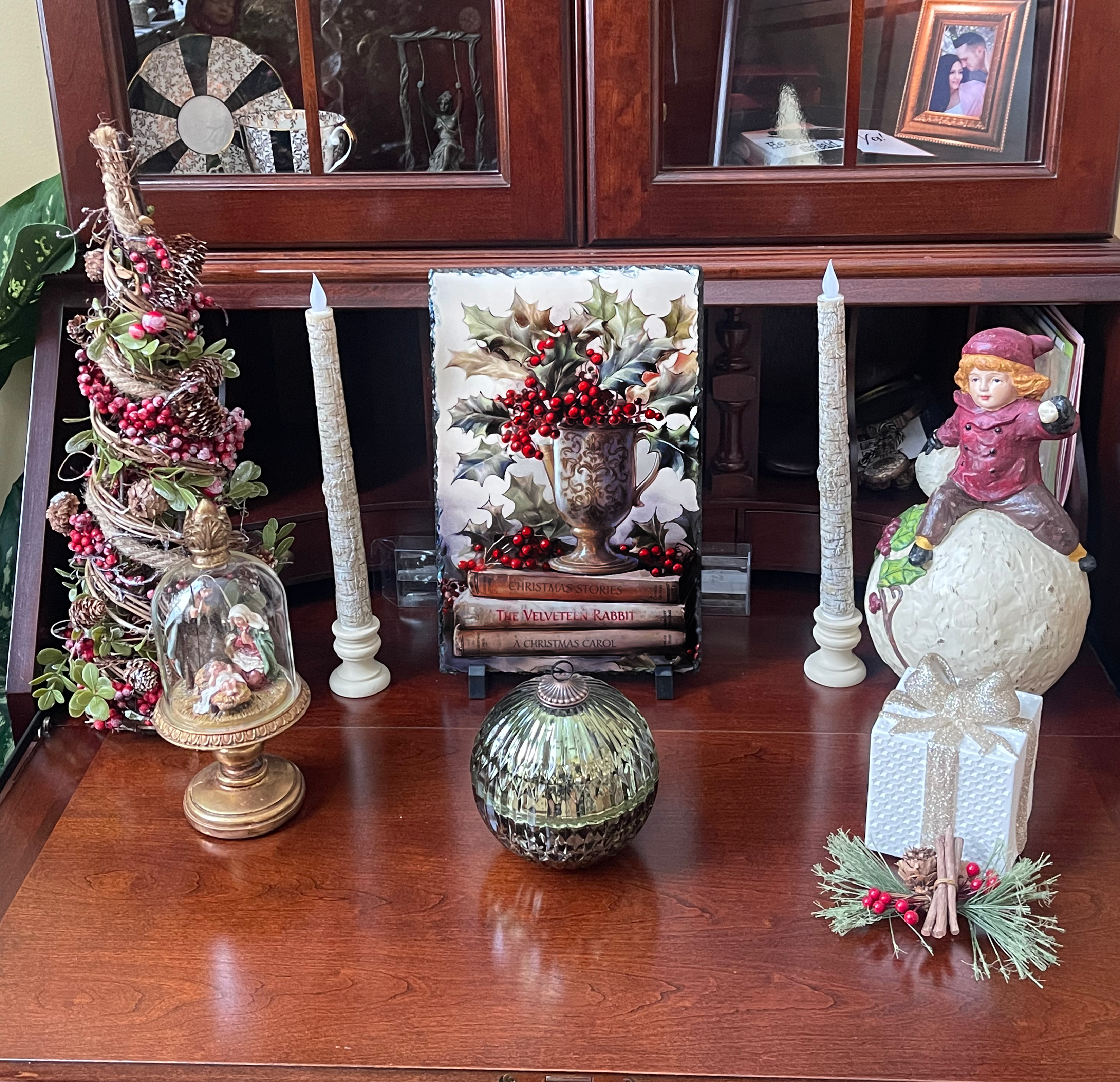 slate displayed on dresser with Christmas decor