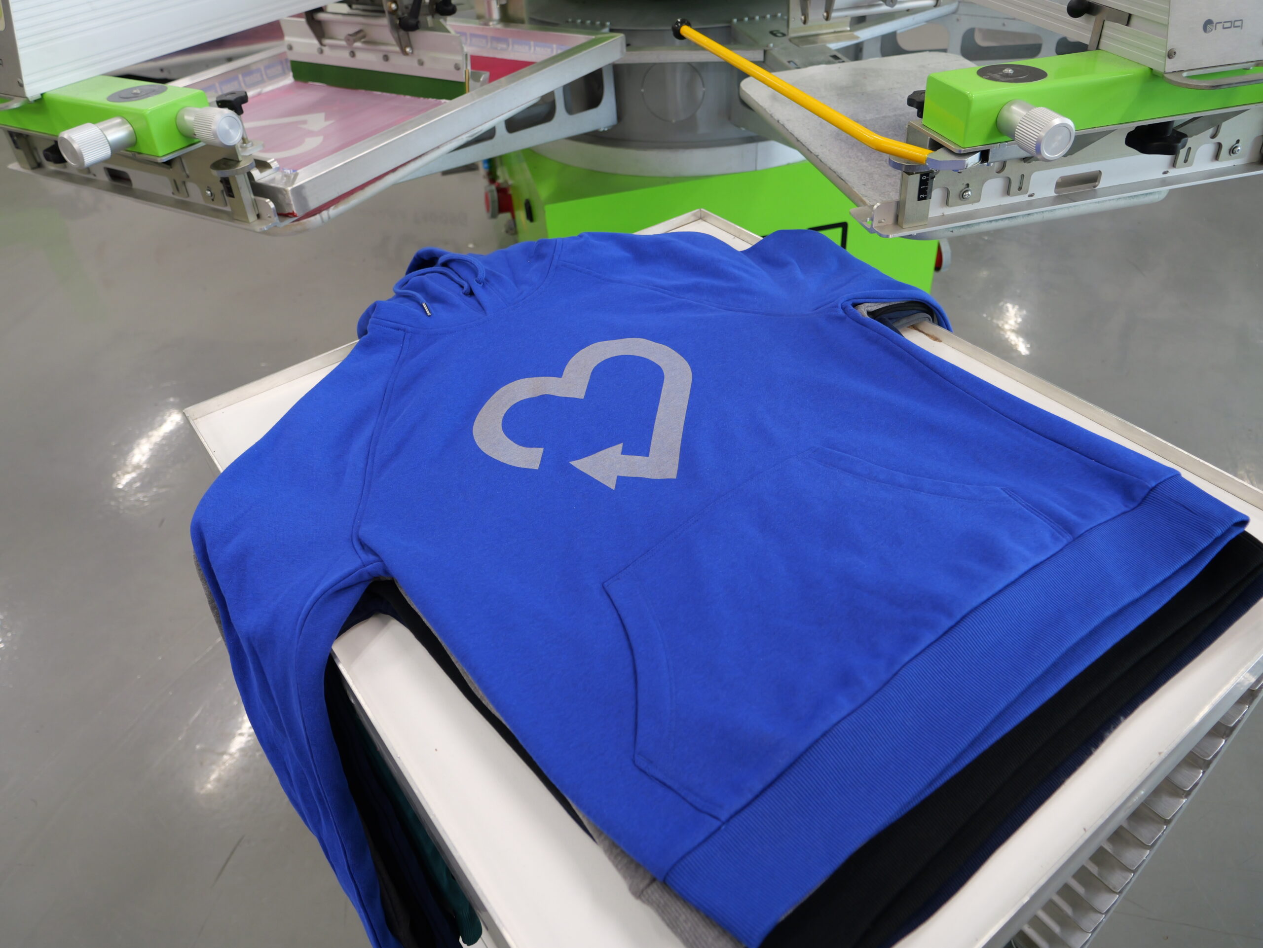 gray heart printed on blue hoodie