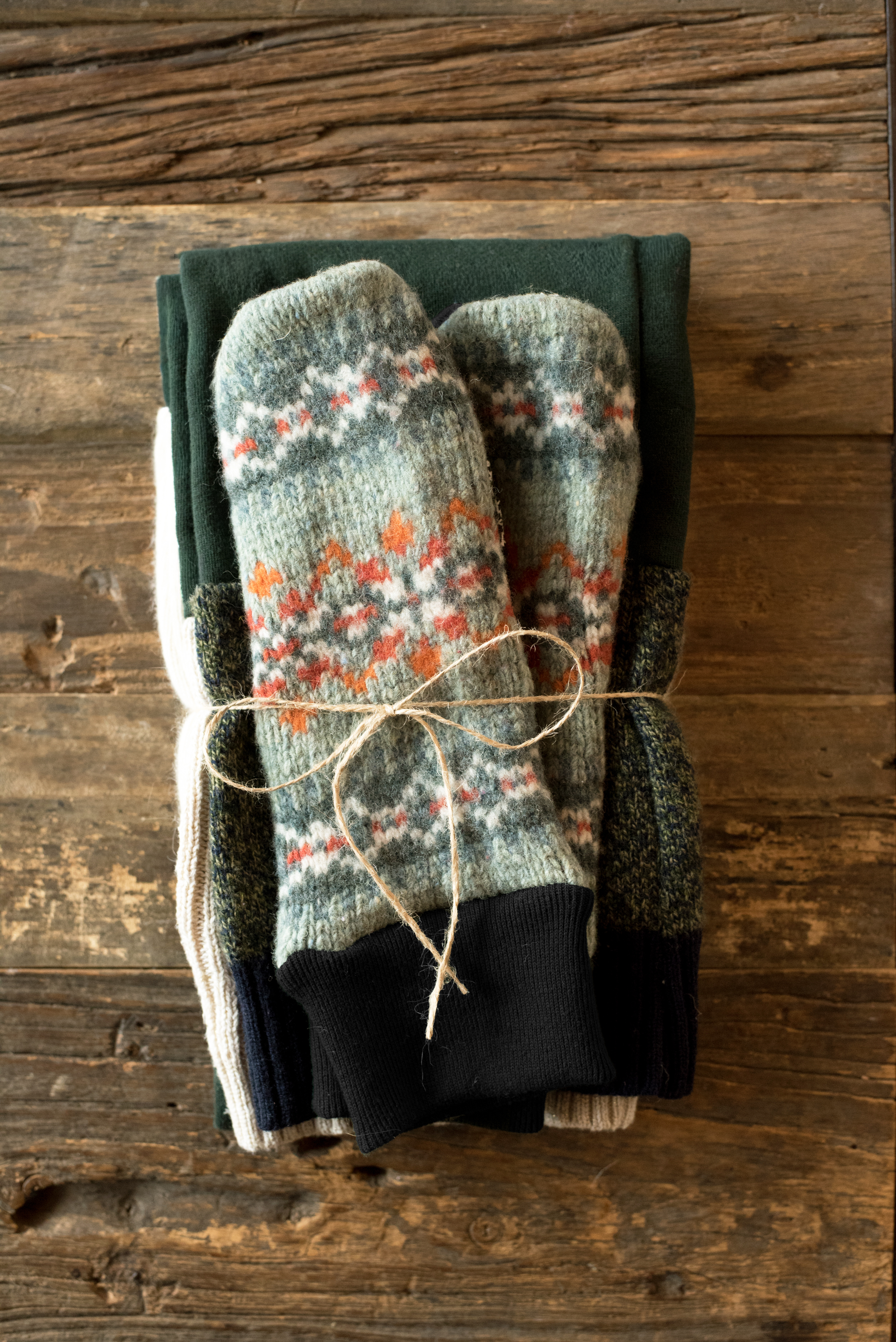 mittens tied together with other textiles