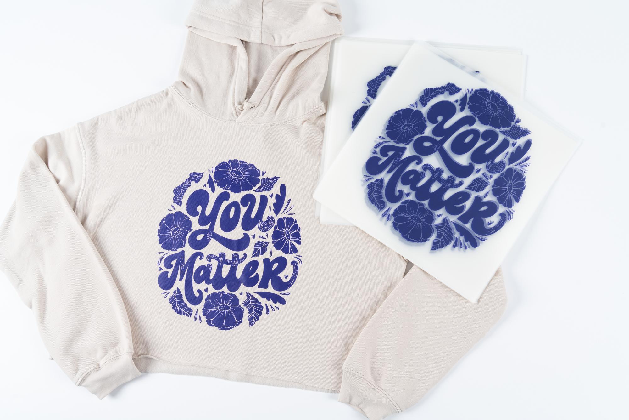 blue screen-printed transfers on white hoodie