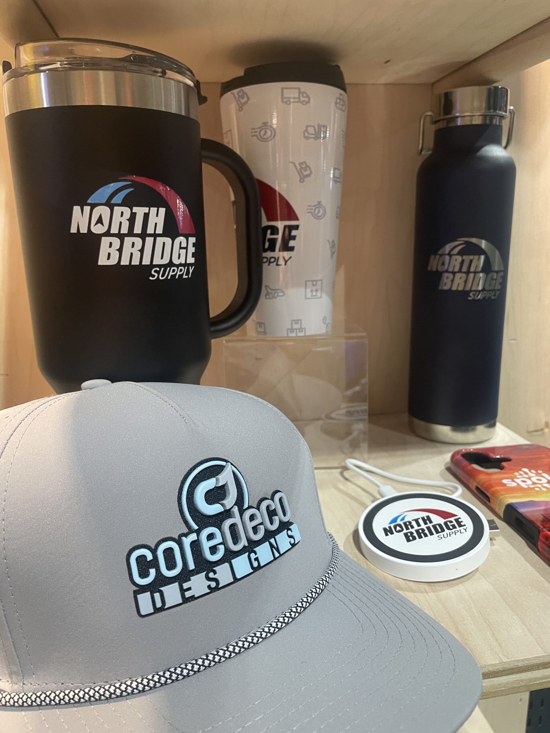 baseball hat in front of tumblers