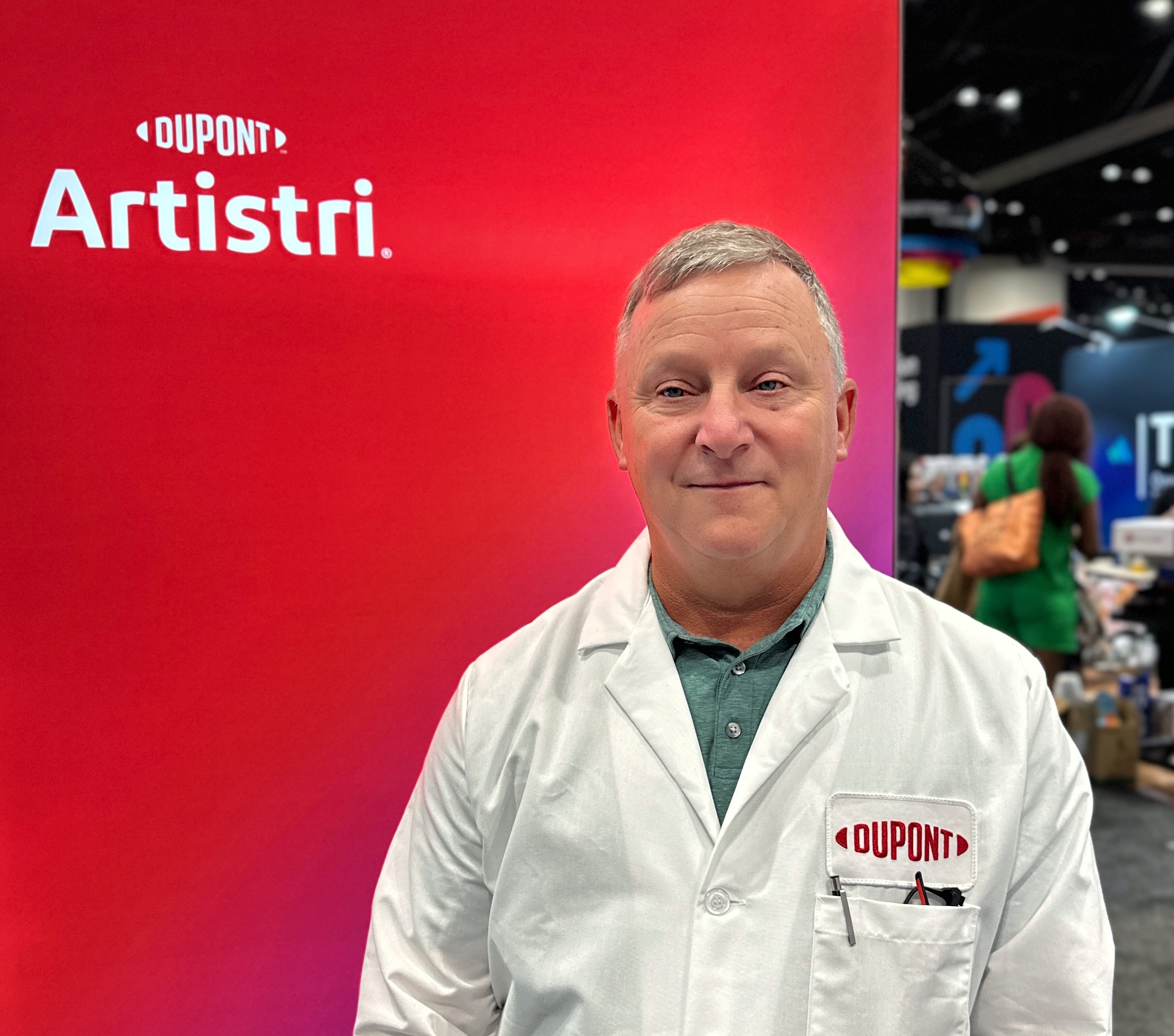 man wearing white jacket with red background
