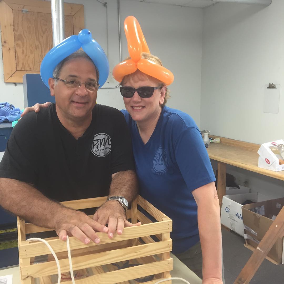 two people wearing balloon hats