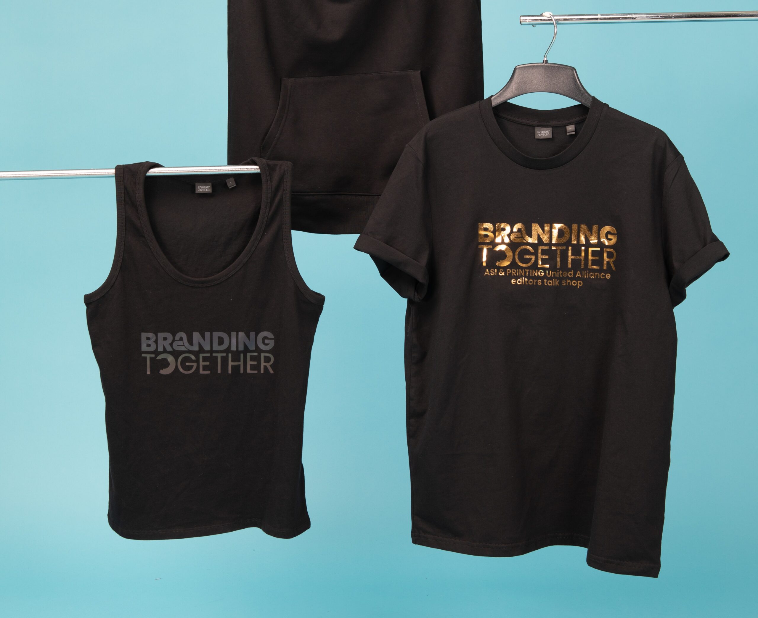 black tank and T-shirt on hangers