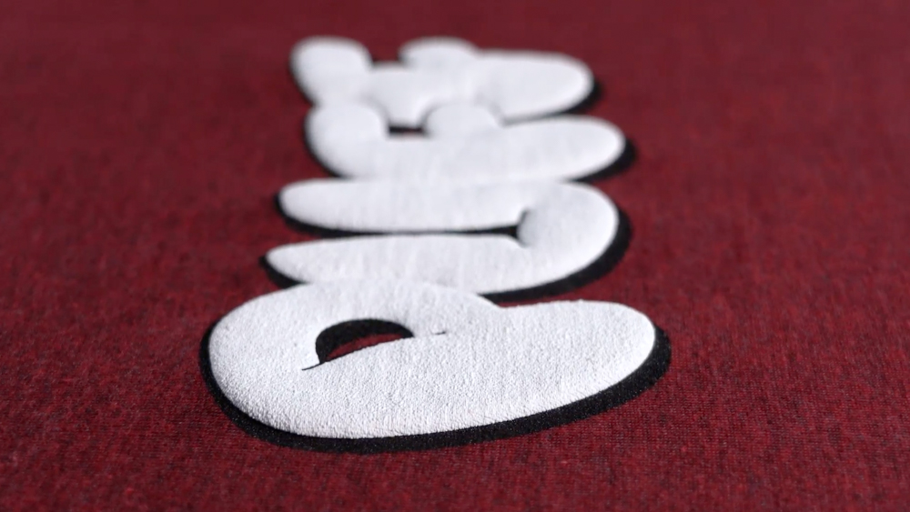 word puff printed on maroon garment