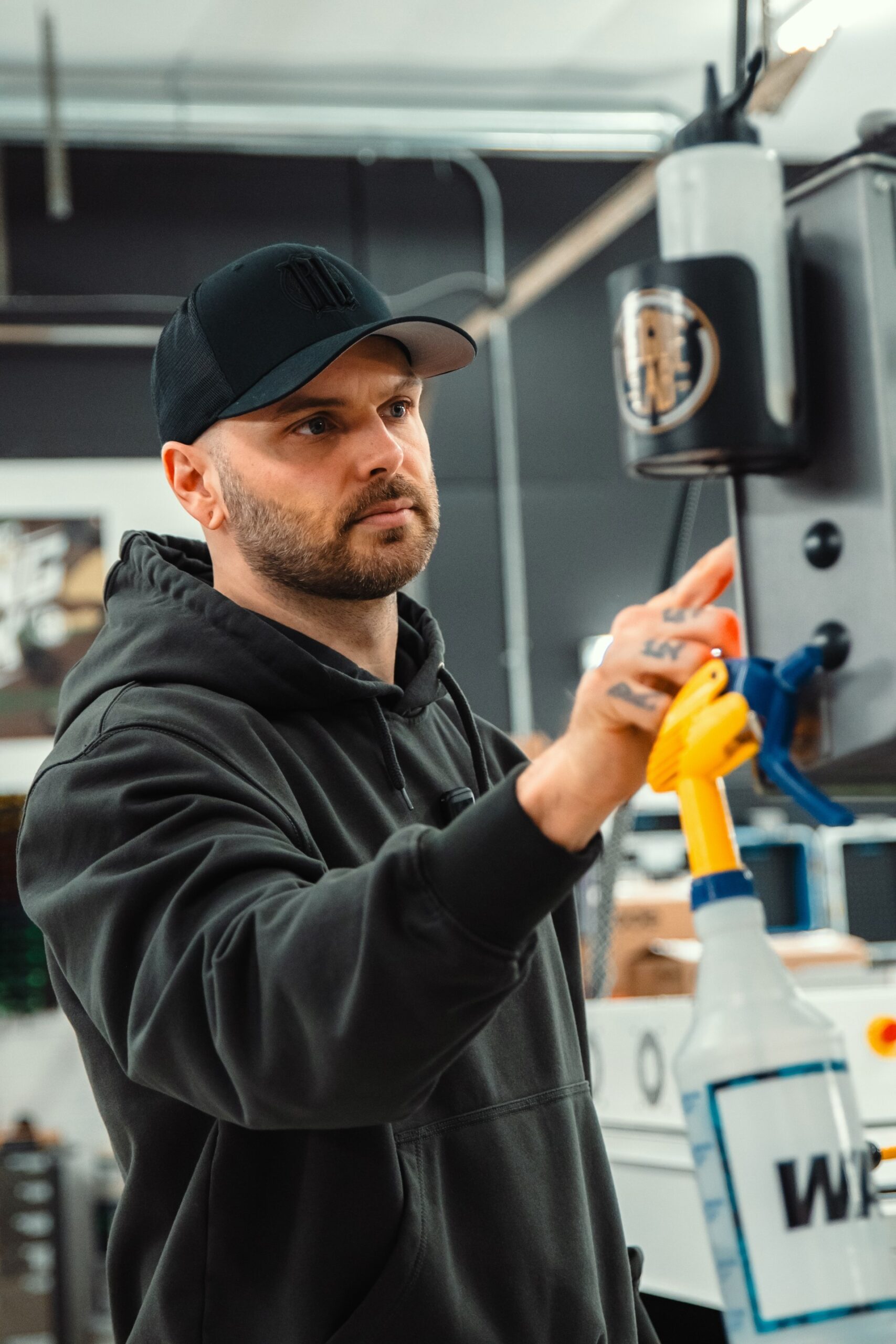 man punching numbers into machine