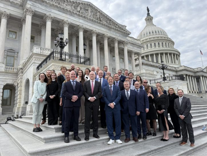 group shot in front of capitol hill