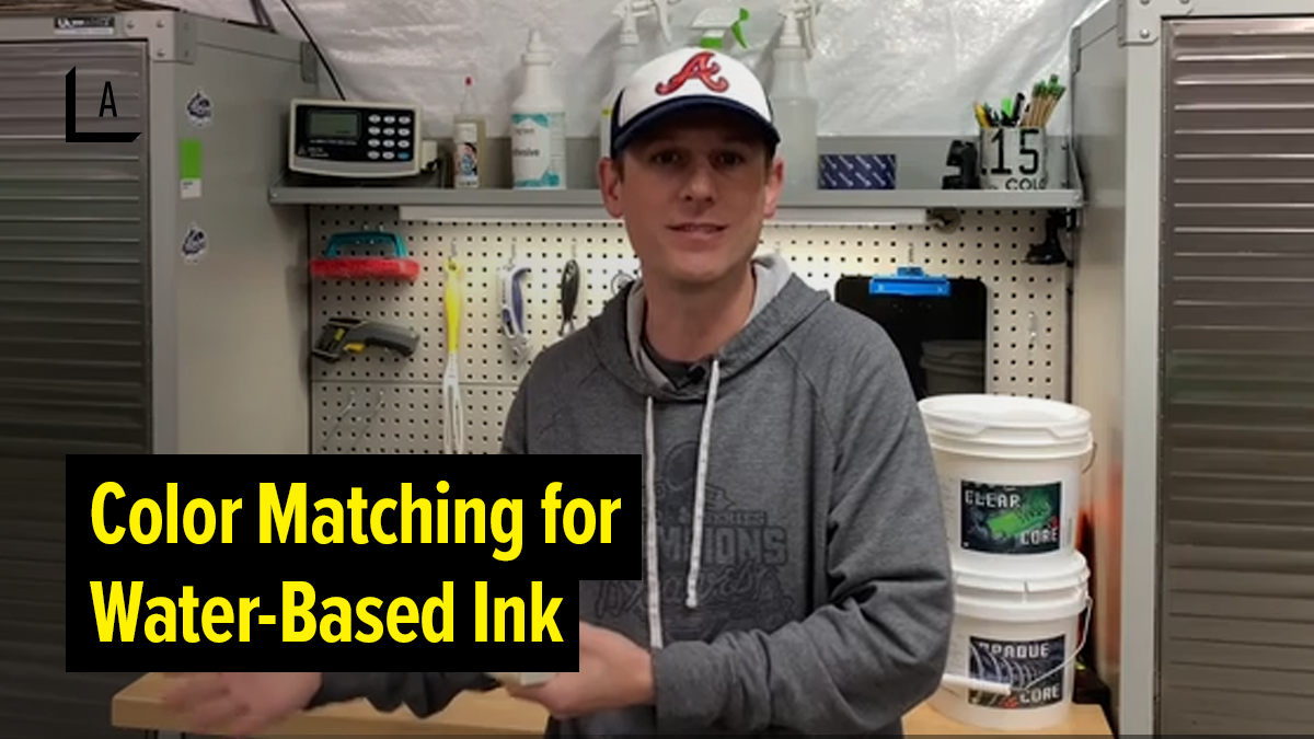 man with hat and gray hoodie