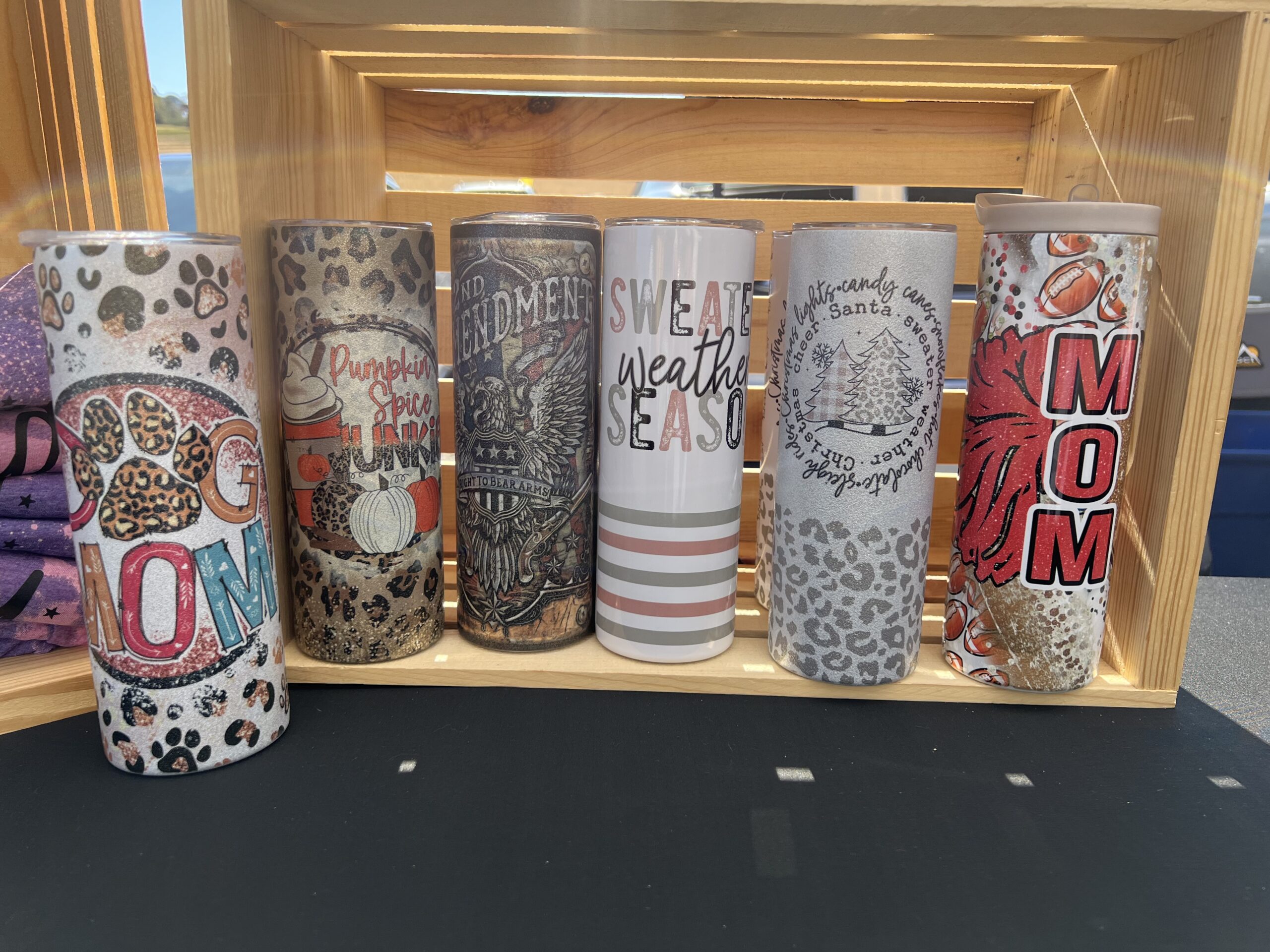 colorful tumblers on shelf