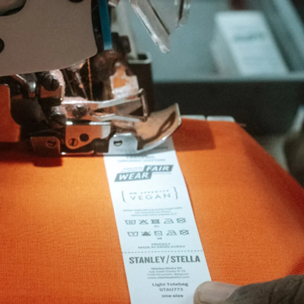 Stanley/Stella Fair Wear tag on an orange T-shirt